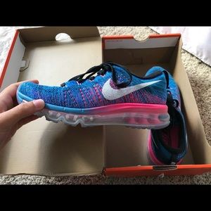 Woman’s Nike Flyknit Max tennis shoes